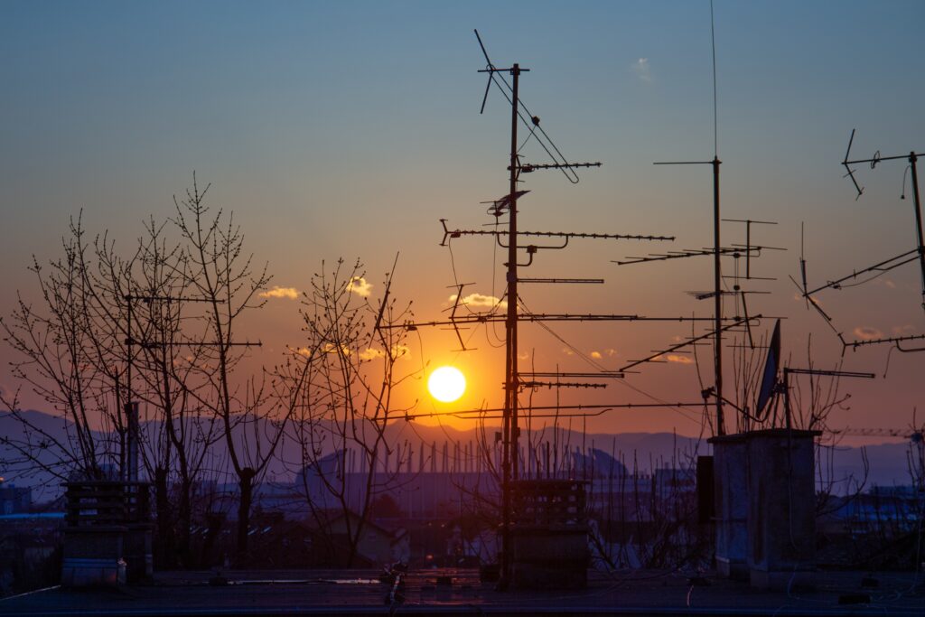 energy and utilities infrastructure with power lines and electrical grid at sunset